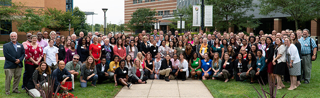 Symposium attendees gathered for a group photo.