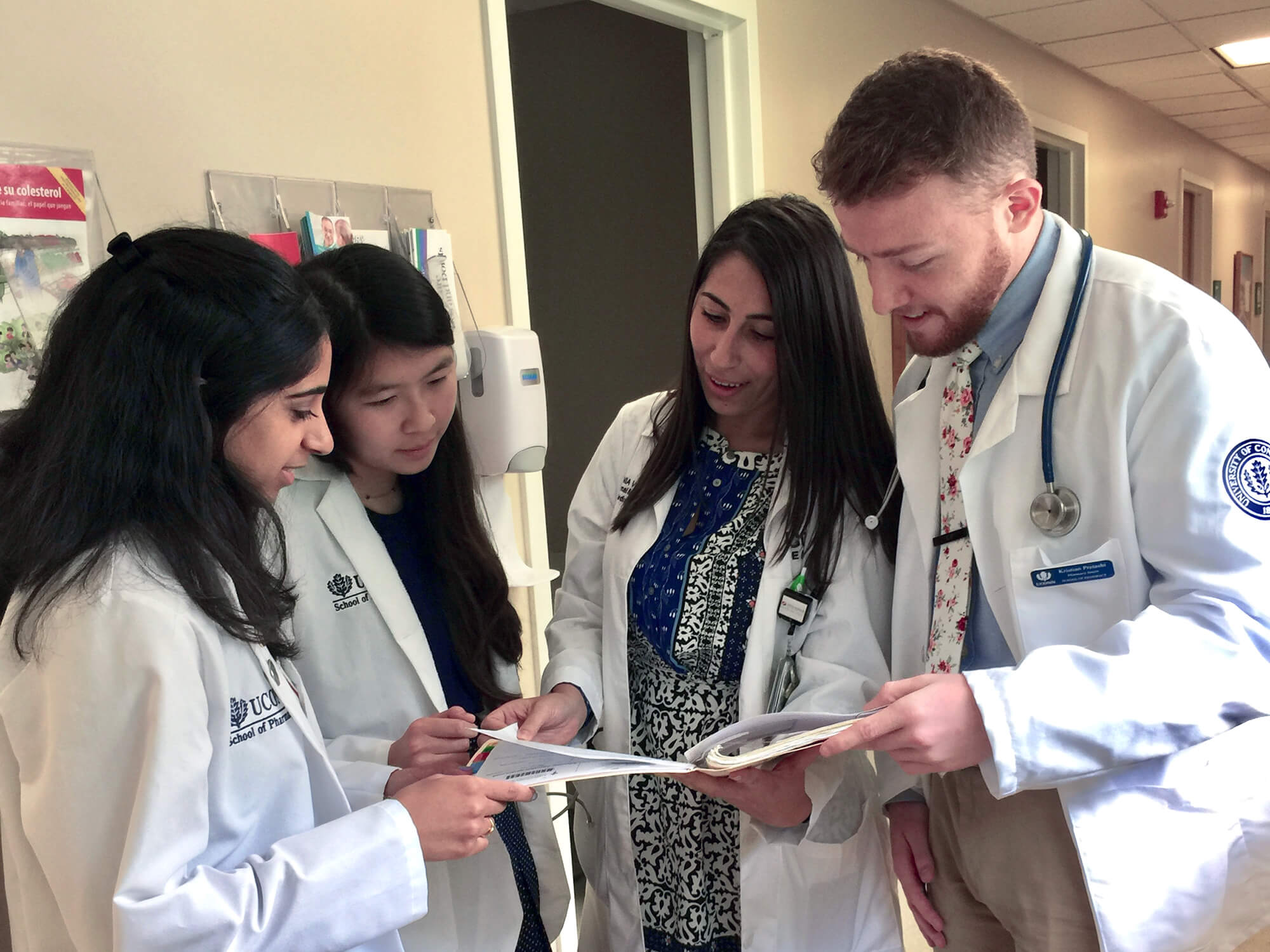 Student Pharmacists in professional care setting.