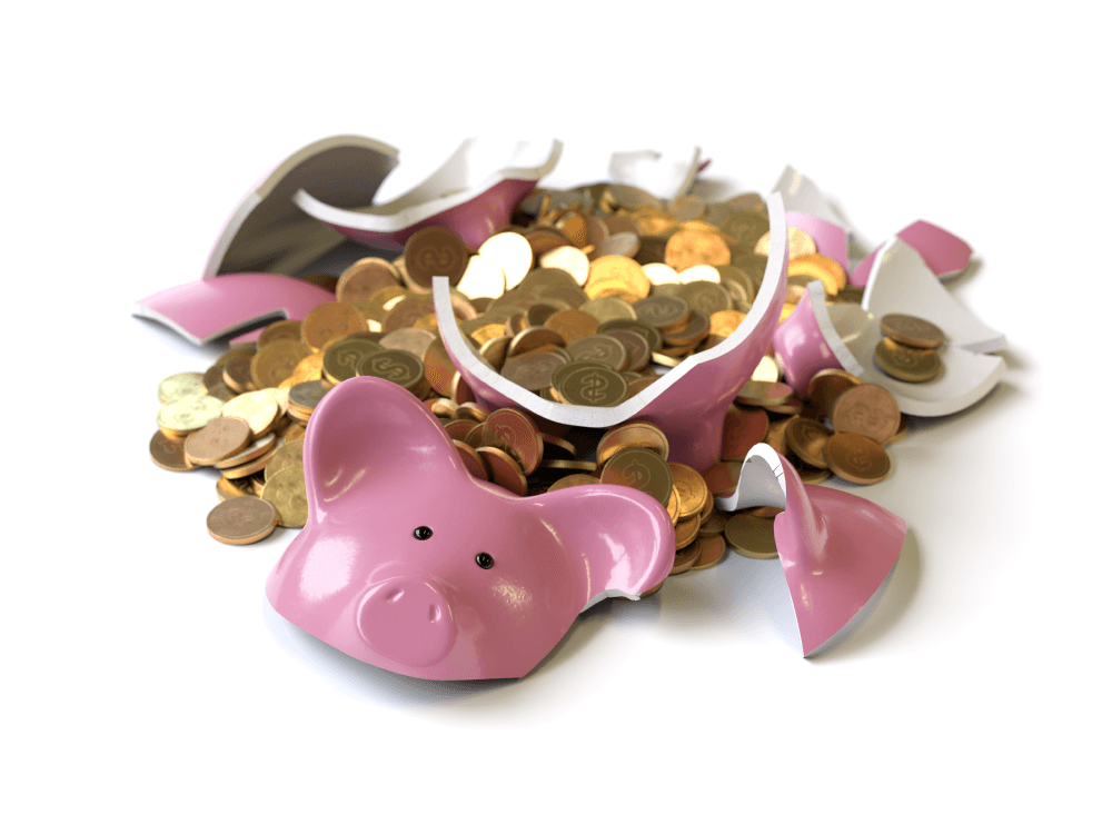 Coins spilling from broken piggy bank.