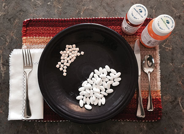 Pills on a dinner plate.