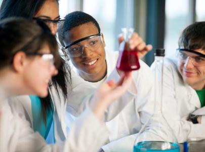 Student pharmacists learning in the lab in pharmacy school.