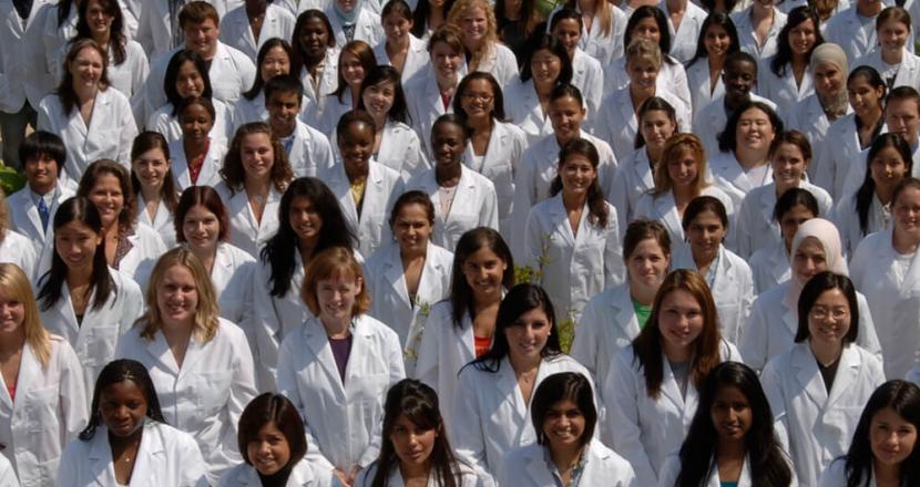 Diverse group of student pharmacists wearing whitecoats