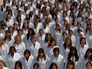 Diverse group of student pharmacists wearing whitecoats