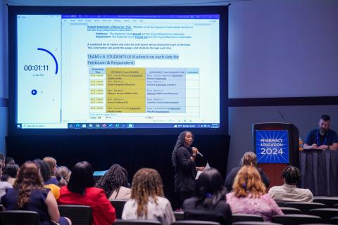 A student pharmacists presents her case during the CPD Section's Student Mock Trial during Pharmacy Education 2024.